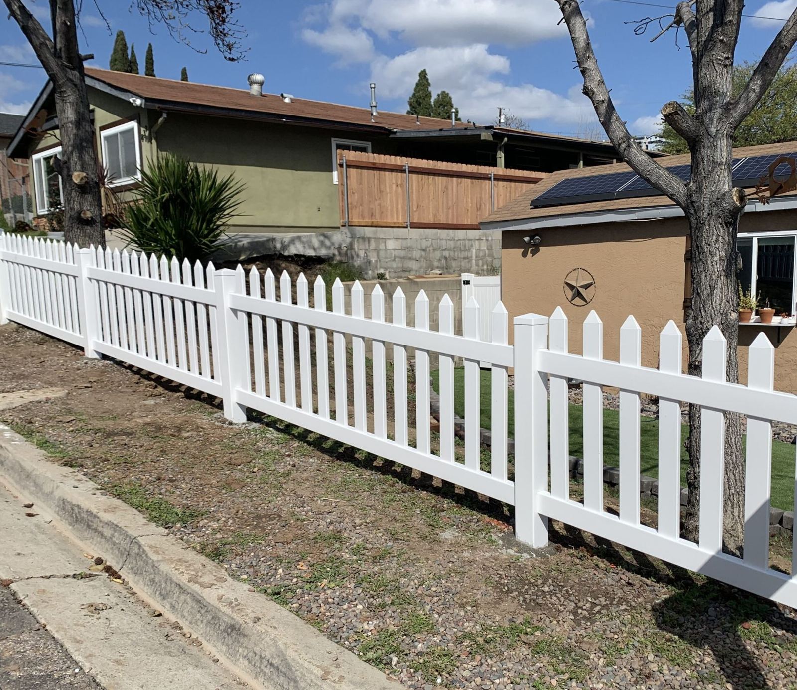 White vinyl picket fence