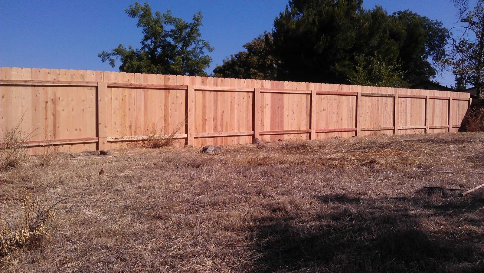 Dog-ear wood fence, long run